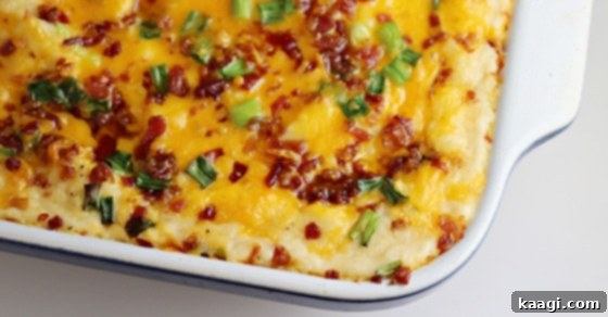 A rich Loaded Baked Mashed Potatoes recipe, packed with cheese, bacon, and garlic.