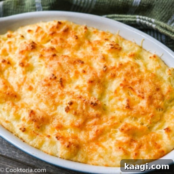 Cheesy, creamy mashed potato casserole, a perfect indulgence.