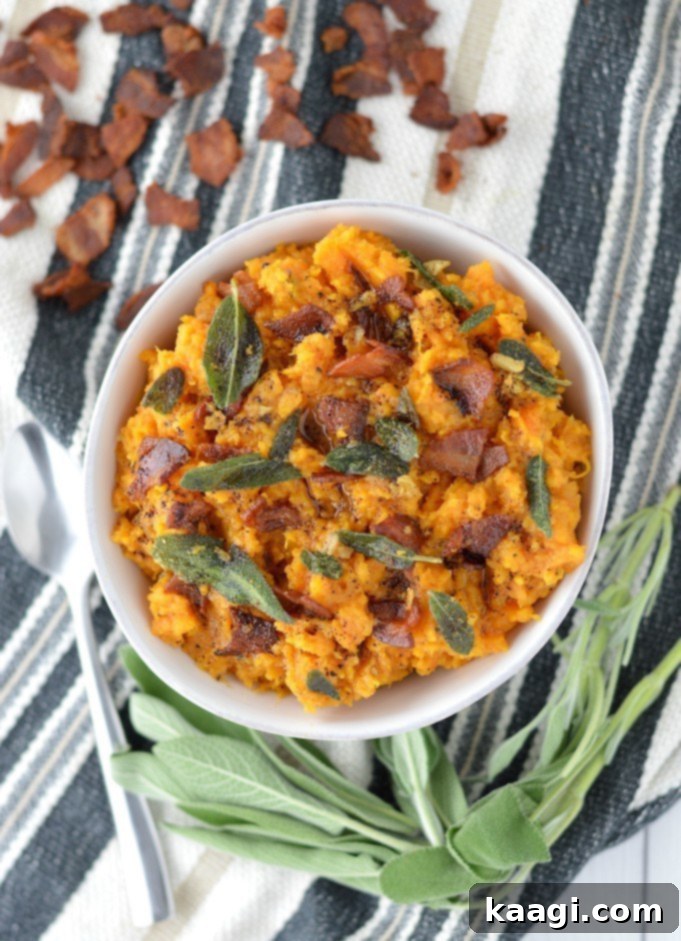Creamy slow cooker mashed sweet potatoes with brown butter, garlic, and sage.