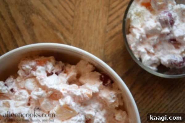 A delightful creamy fruit salad, reminiscent of childhood holidays.