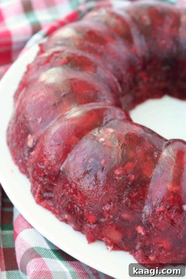 A festive Old-Fashioned Cranberry Salad, also known as a Cranberry JELLO mold.