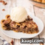 A plate with a perfect slice of Pecan Pie, adorned with a scoop of melting vanilla ice cream, promising a delightful dessert experience.