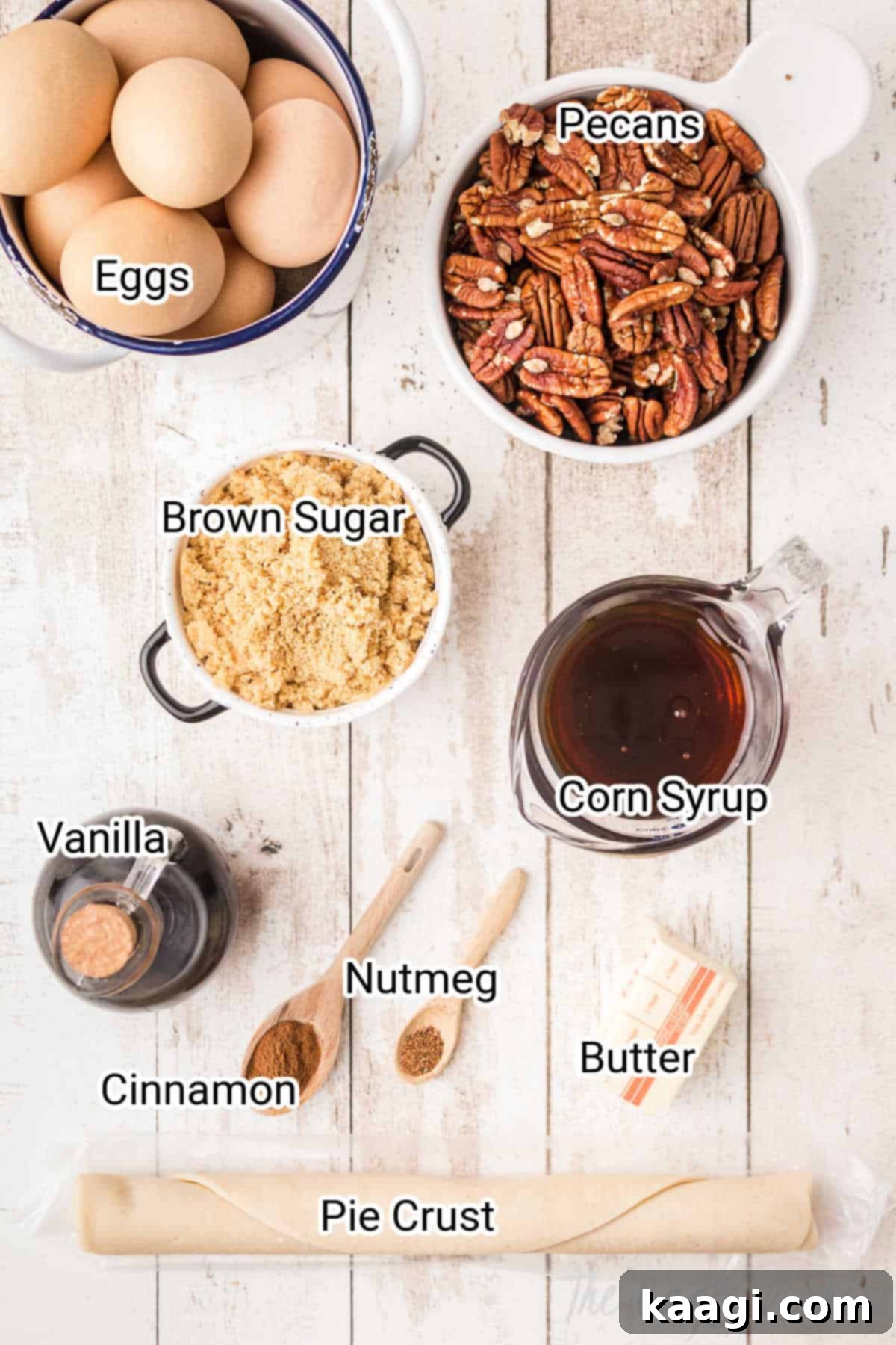 A beautiful flat lay photograph displaying all the essential ingredients for Old Fashioned Pecan Pie, including butter, sugars, pecans, eggs, and corn syrup, ready for baking.
