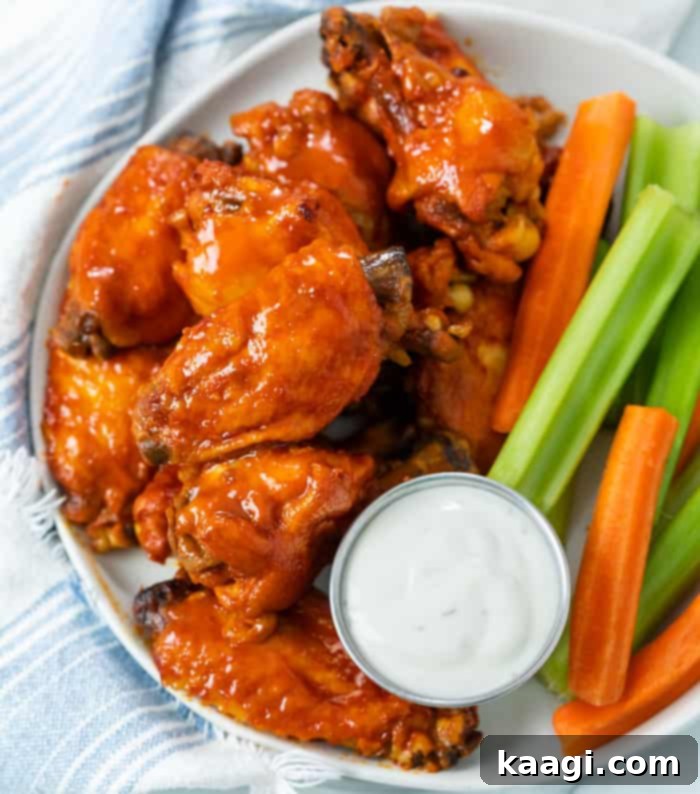 Crock Pot Chicken Wings, tender and juicy, with options for a crispy finish, served as a perfect party snack.
