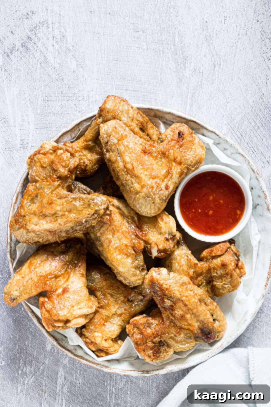The Best Air Fryer Frozen Chicken Wings, golden and crispy, ready to be devoured.