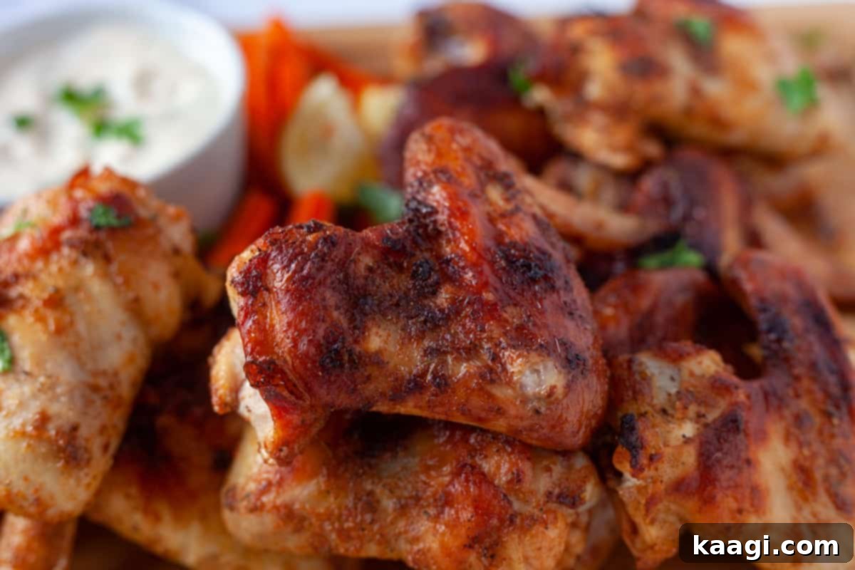 Creole Butter Wings, oven-baked and seasoned with a rich Creole blend, glistening with salty butter.