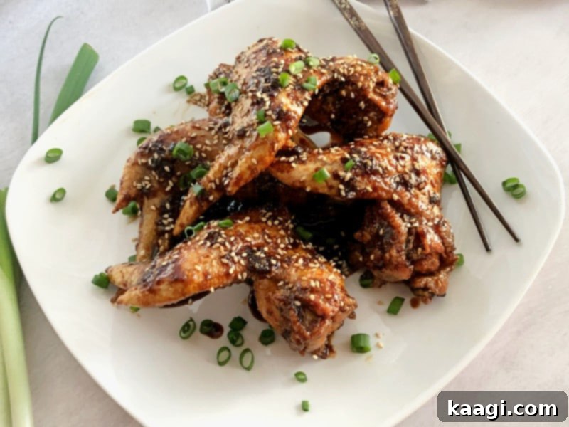 Crispy Baked Asian Chicken Wings, sweet, salty, and sticky, for a healthier party appetizer or weeknight meal.
