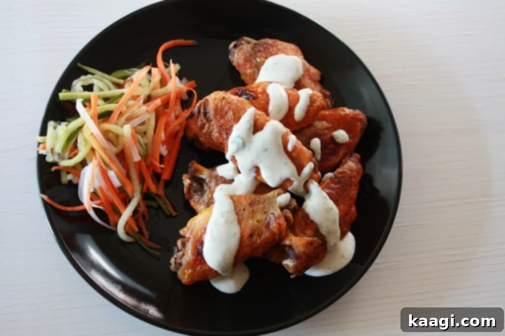 Instant Pot Buffalo Chicken Wings, infused with bold flavors and ready to be crisped to perfection.