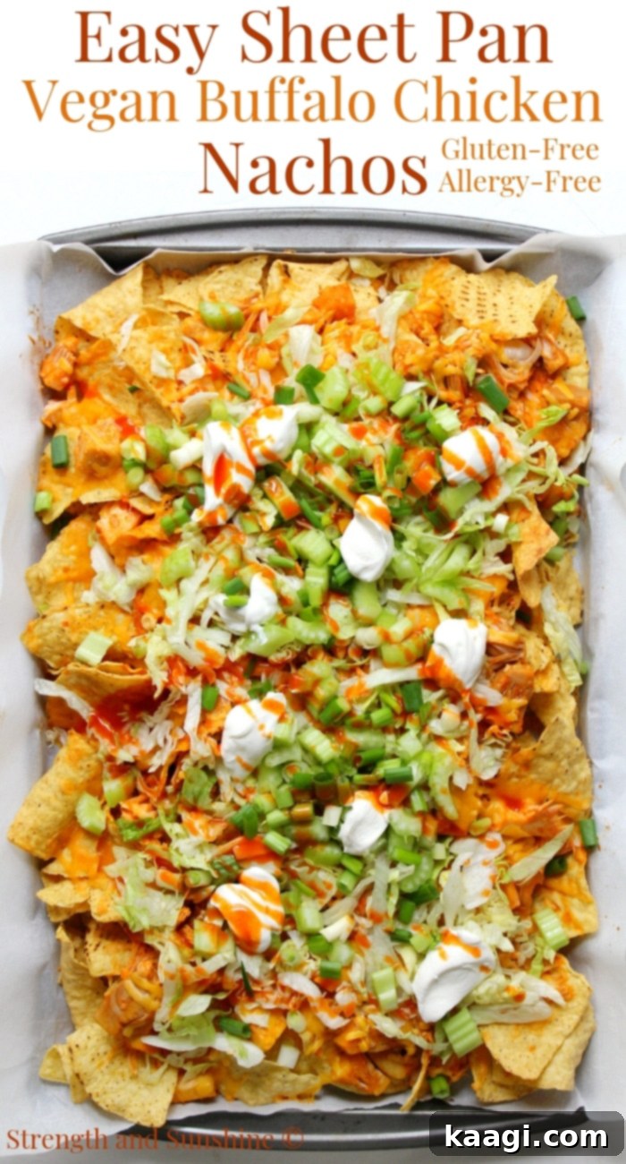 Easy Sheet Pan Vegan Buffalo Chicken Nachos, gluten-free, allergy-free, and 100% meatless, for a quick and spicy snack or dinner.