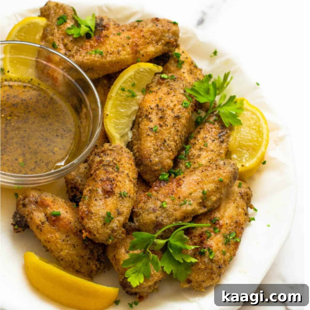 Air Fryer Lemon Pepper Chicken Wings coated in a bright, zesty glaze, ready to serve.