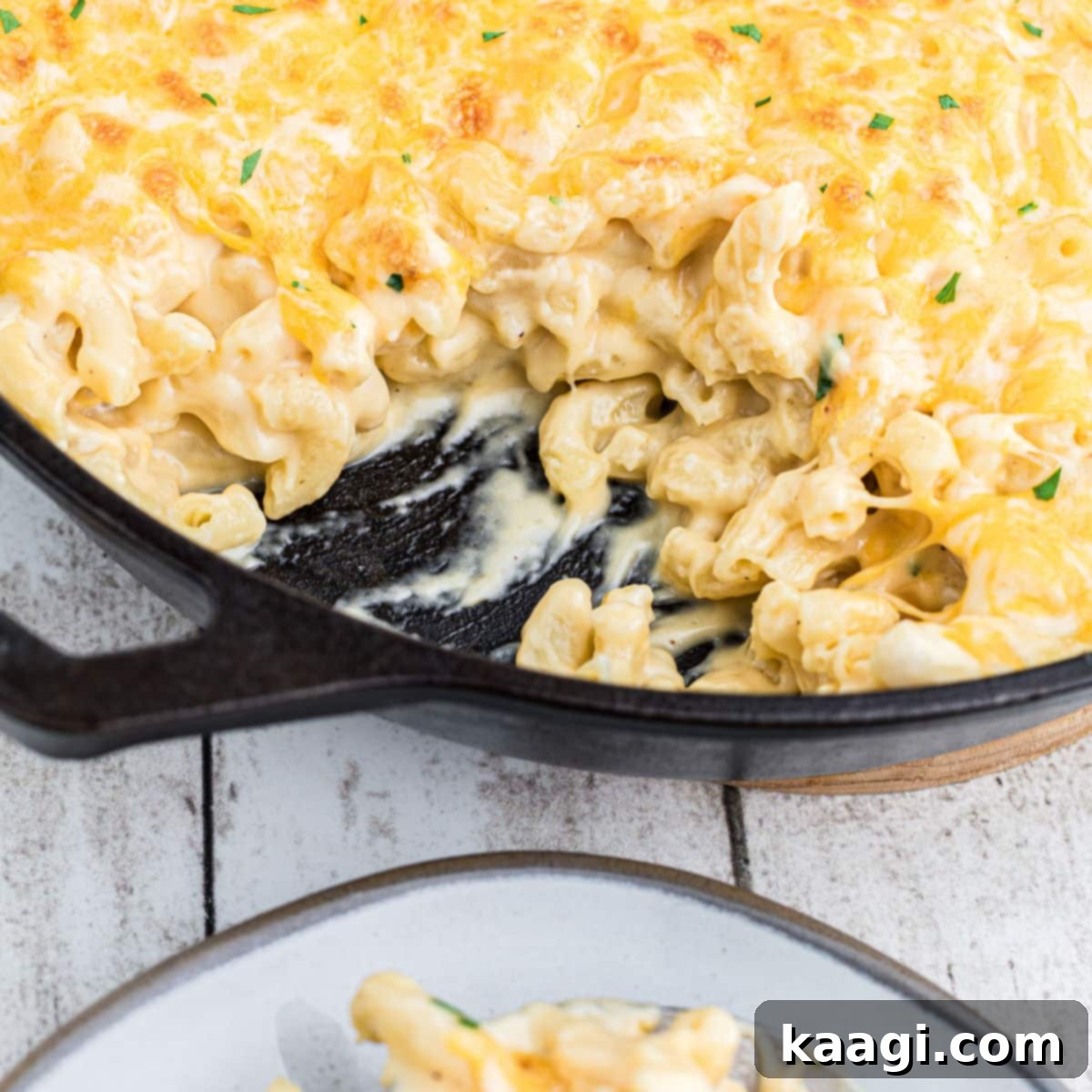 Close-up of a skillet of Copycat Cracker Barrel Mac and Cheese, deliciously creamy and inviting.