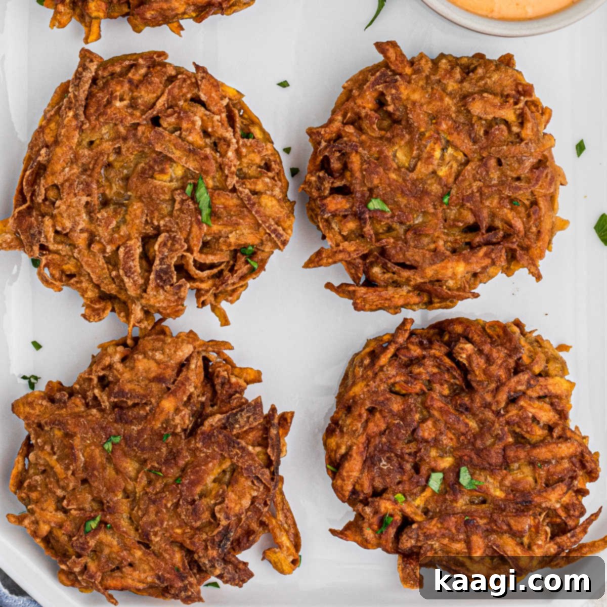 Overhead close-up shot of a sweet potato fritter recipe, crispy and infused with fall spices.