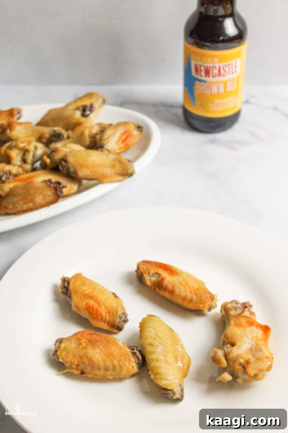 Juicy beer brine chicken wings, cooked to a perfect crisp with meat falling off the bone, ready for a dipping sauce or enjoyed as is.