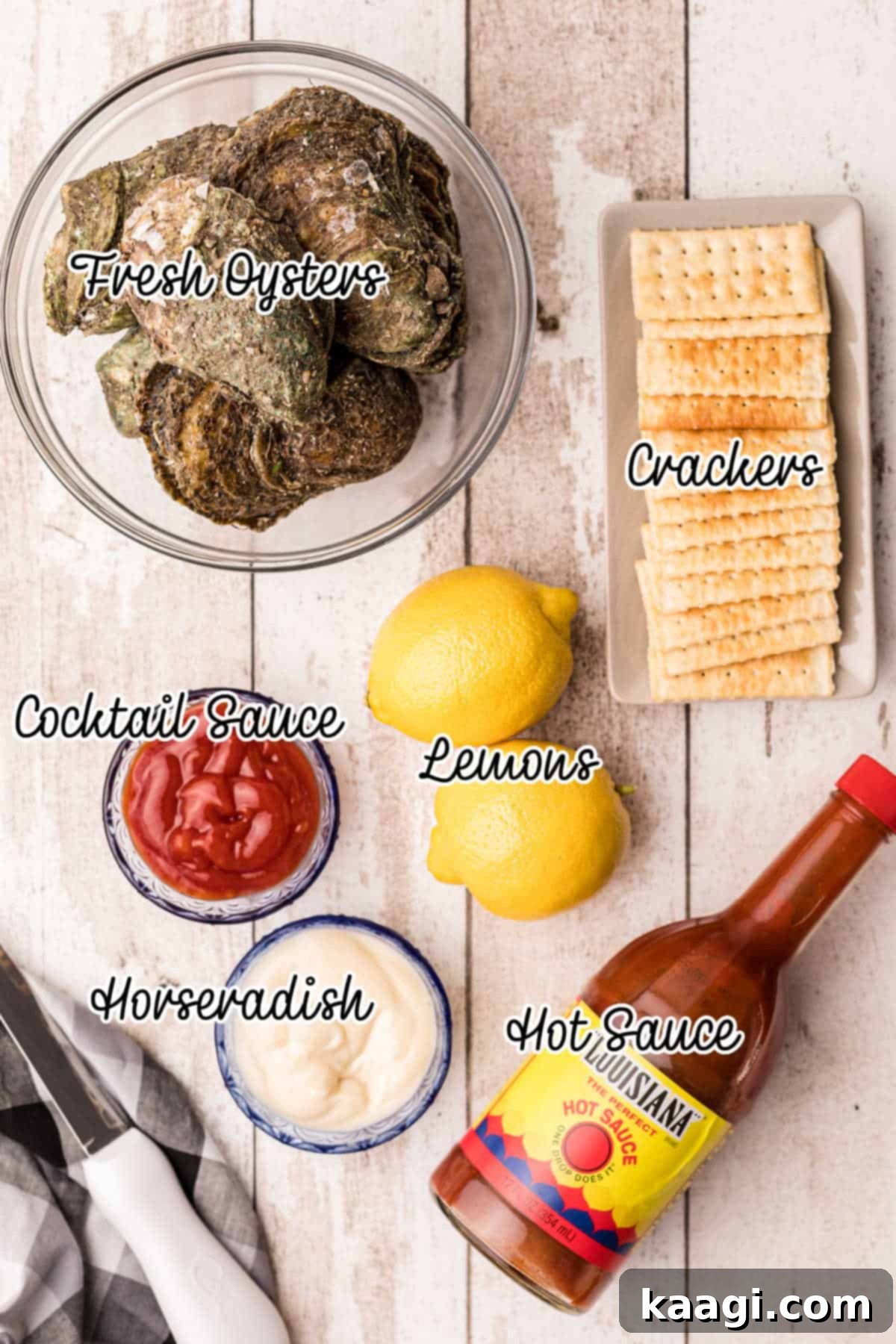A selection of ingredients for raw oysters, including sauces, lemons, and crackers.
