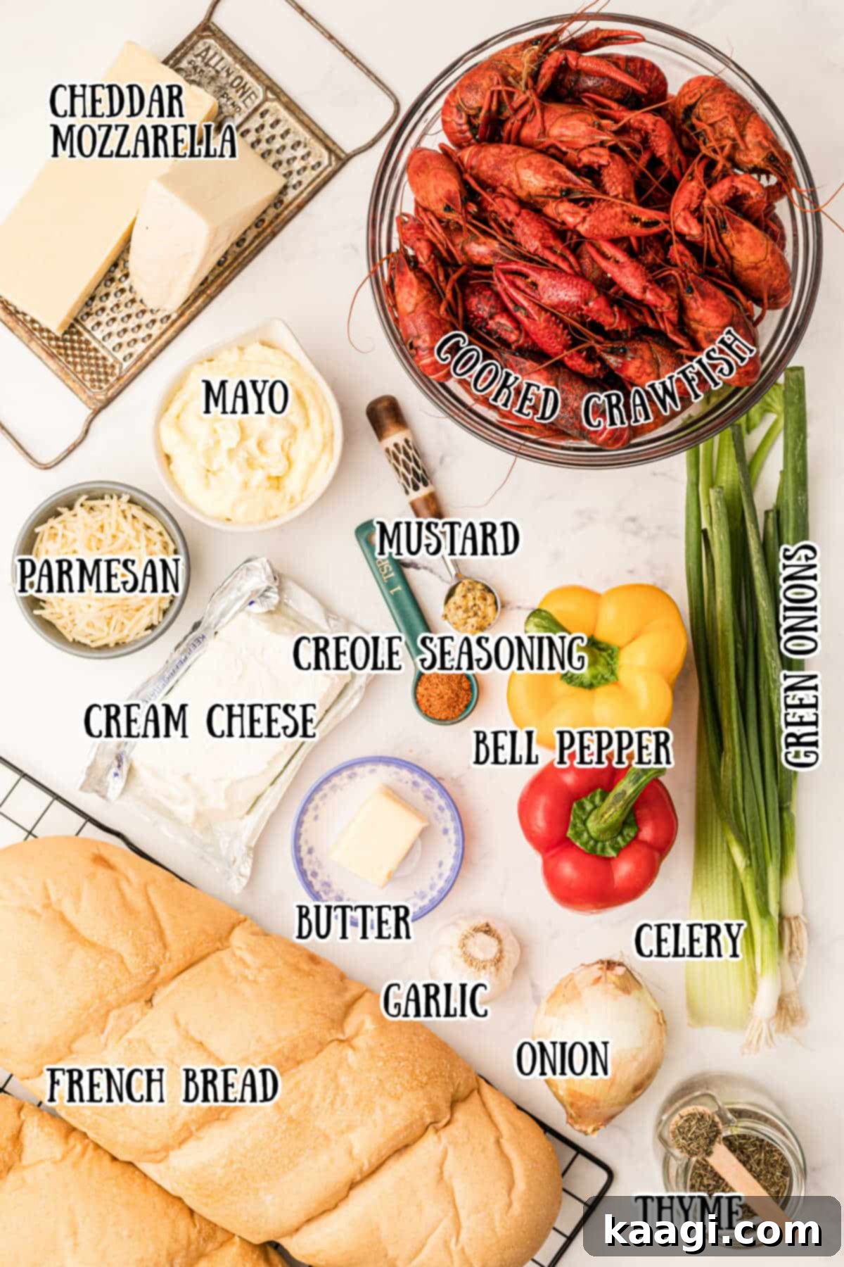 A vibrant display of all the fresh ingredients meticulously arranged for a crawfish bread recipe, showcasing their quality and readiness for cooking.