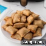 a plate full of air fryer pizza rolls