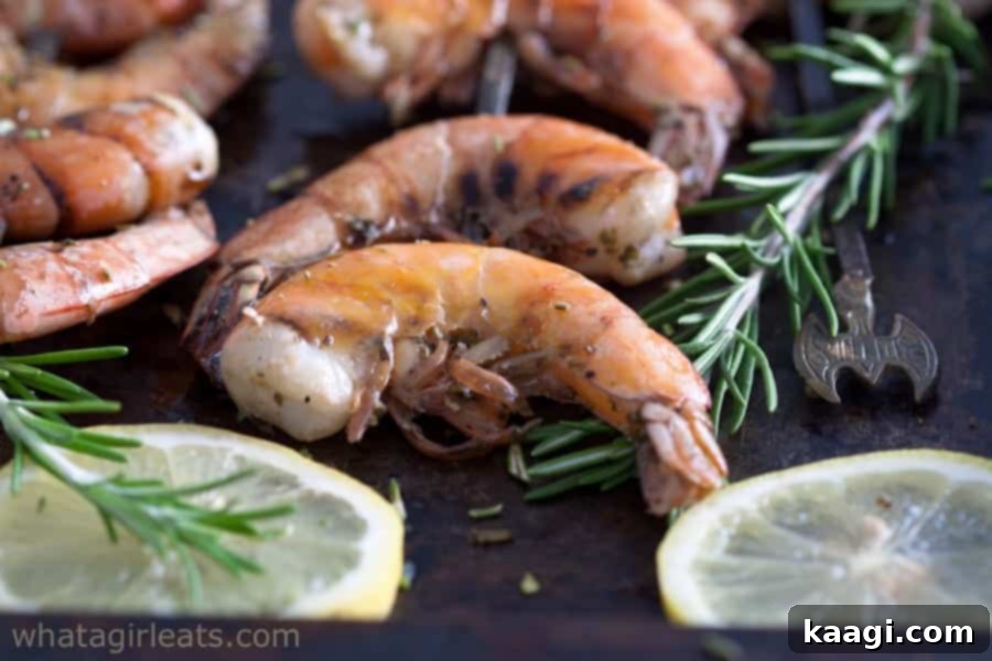Grilled rosemary shrimp with lemon wedges