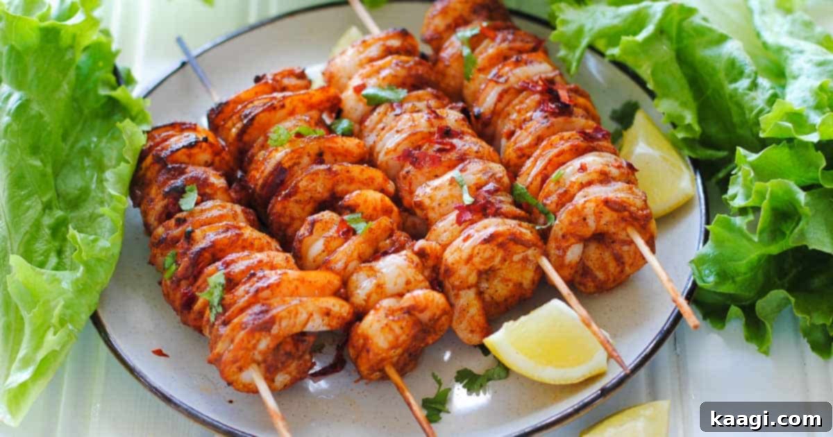 Grilled Tandoori shrimp skewers with lemon and lettuce