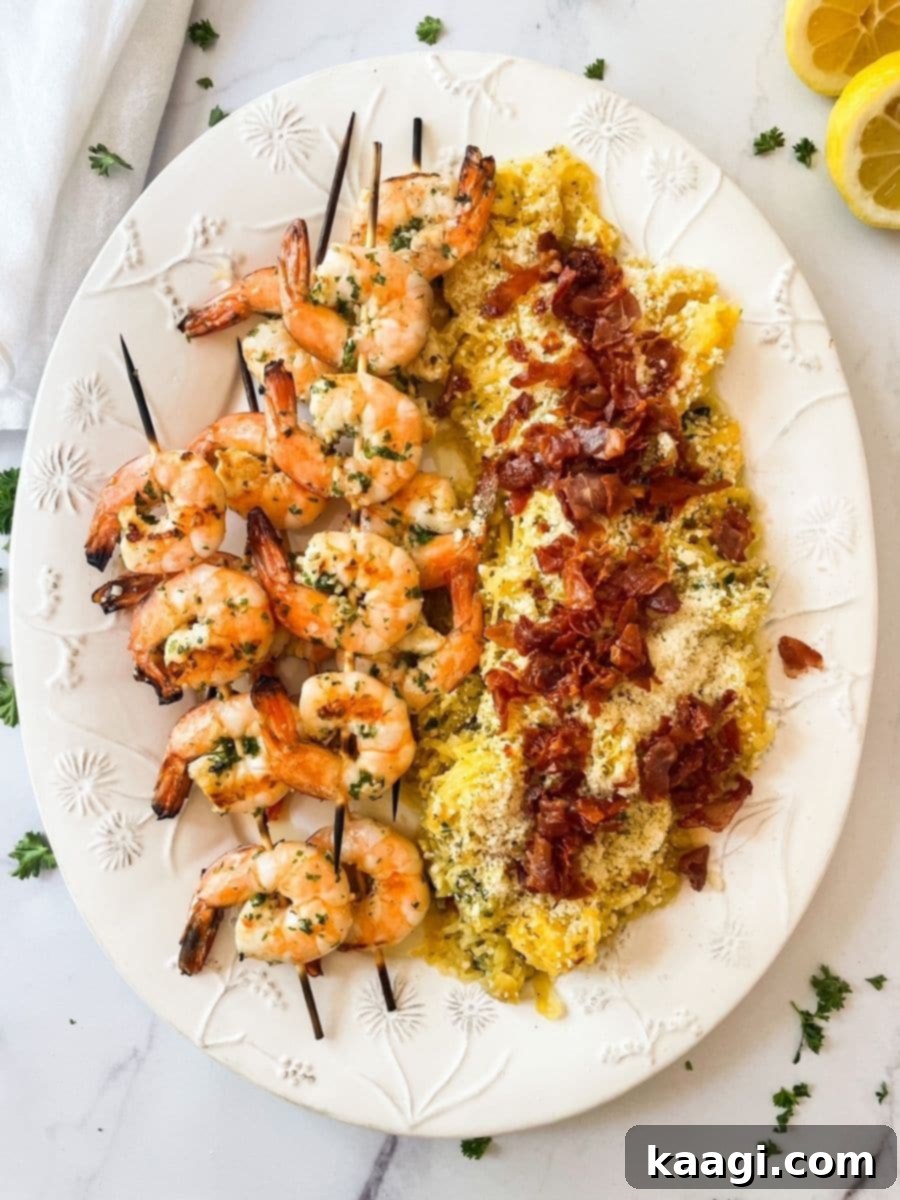 Grilled butter garlic shrimp and spaghetti squash with crispy prosciutto