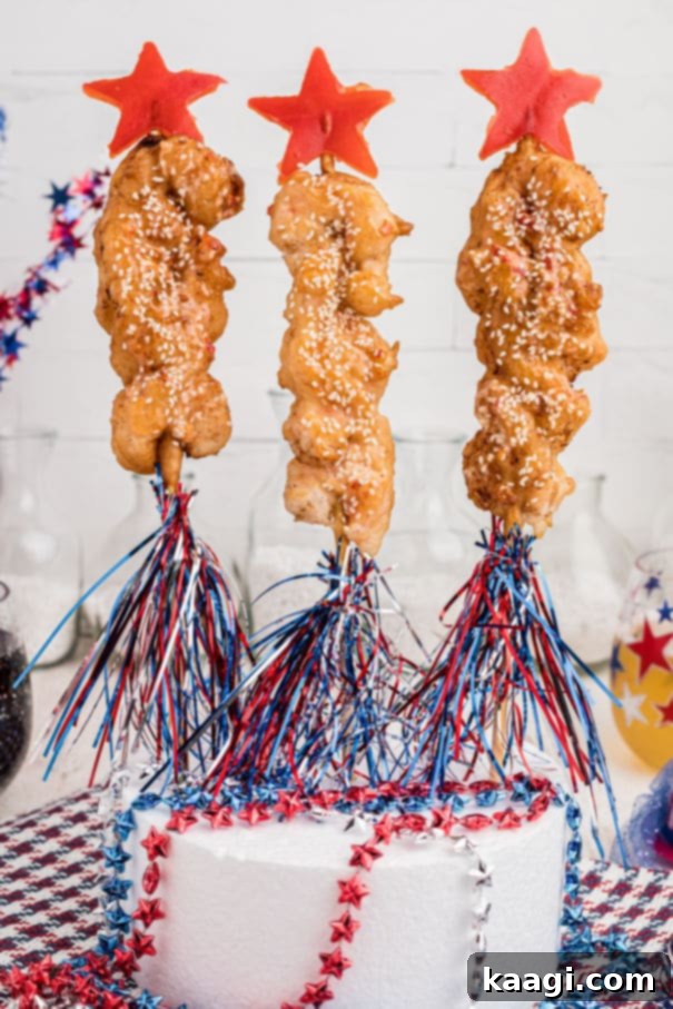 Some fried Boom Boom Shrimp arranged artfully on skewers, resembling festive firework rockets, perfect for a celebration.