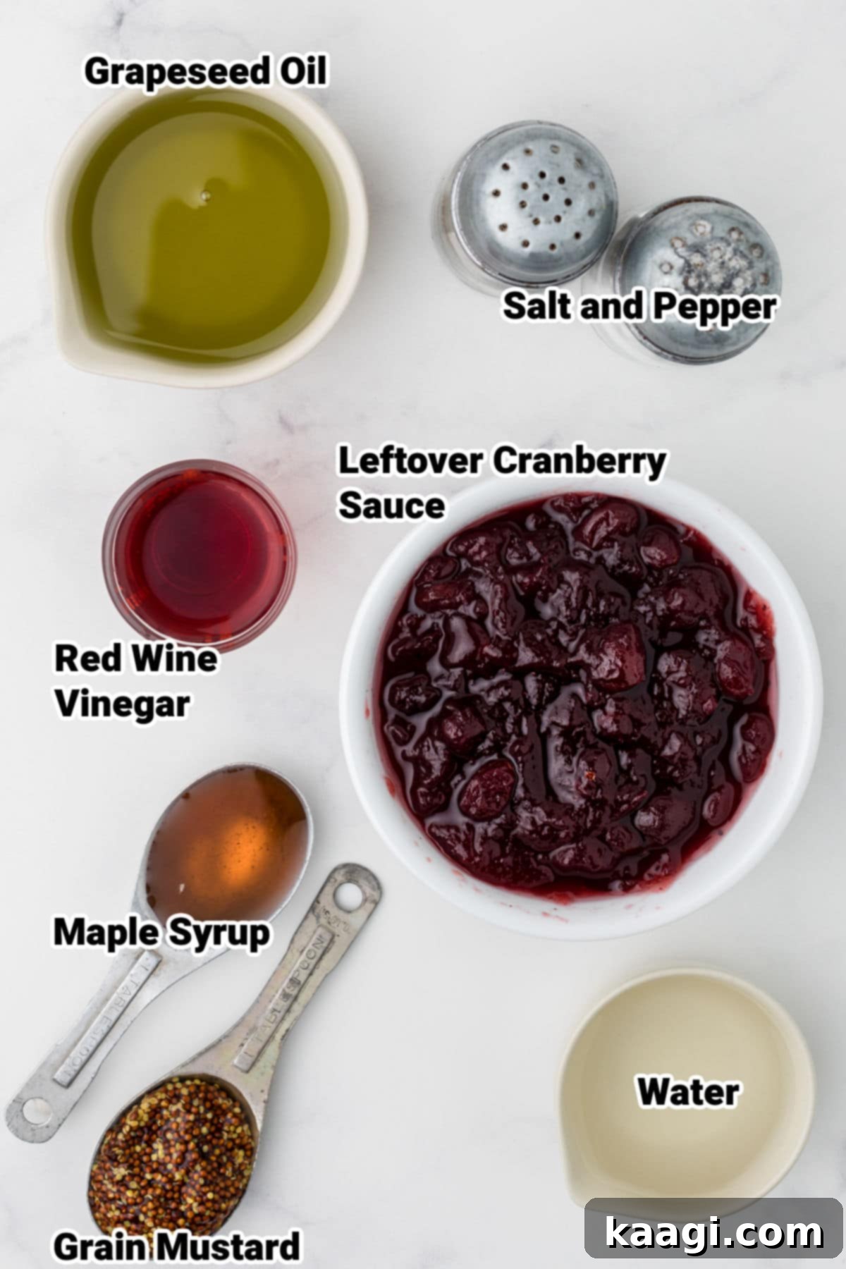 Crimson Vinaigrette 3 All the essential ingredients for homemade cranberry vinaigrette neatly laid out on a kitchen counter, ready for blending.