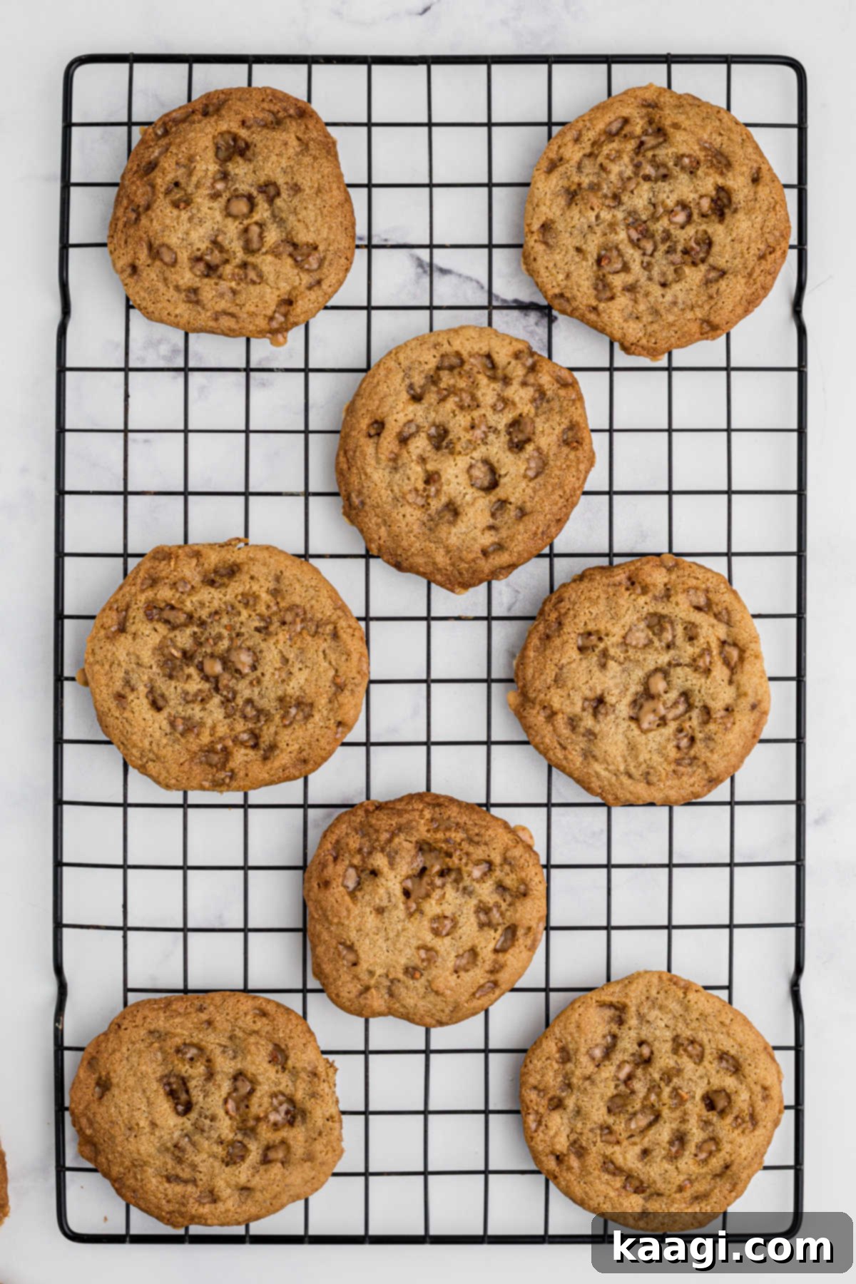 Buttery Crisp Delights 6 Freshly baked butter crunch cookies cooling on a wire rack.