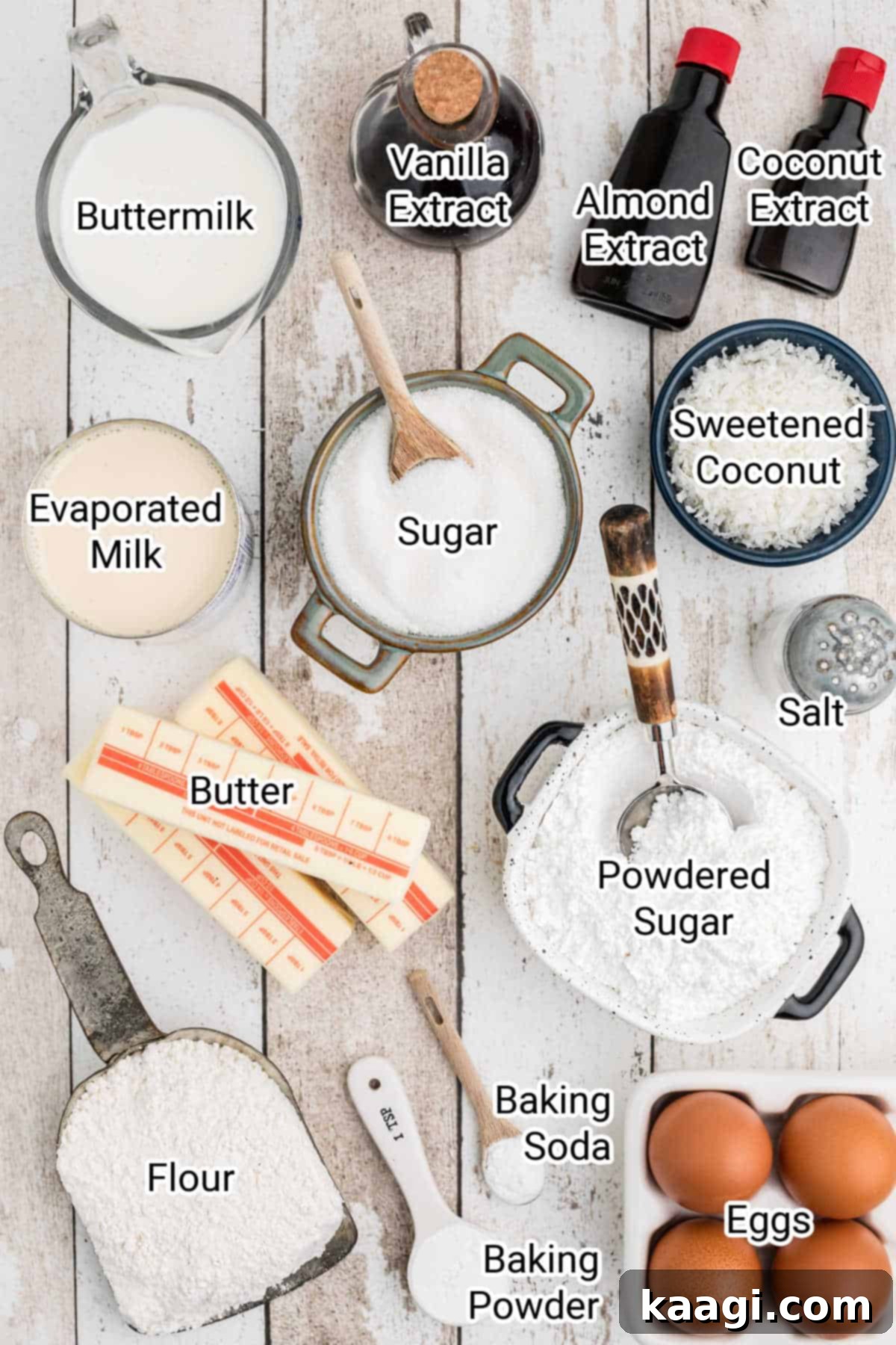 ingredients for a louisiana crunch cake laid out on a wooden surface with labels