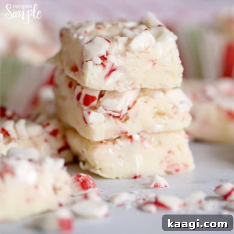 76 Effortless Christmas Goodies 18 White Chocolate Peppermint Fudge garnished with candy cane pieces