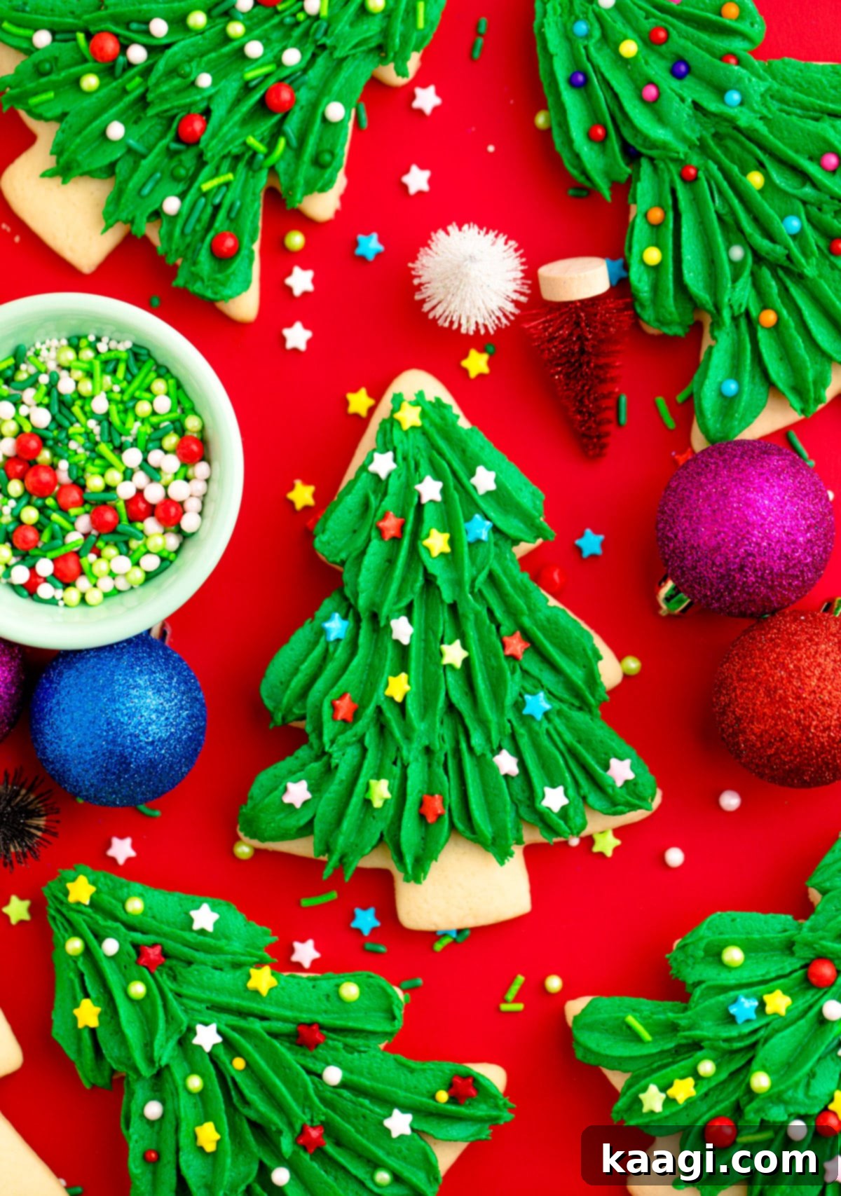 76 Effortless Christmas Goodies 49 Christmas Tree Cookies with green icing and star