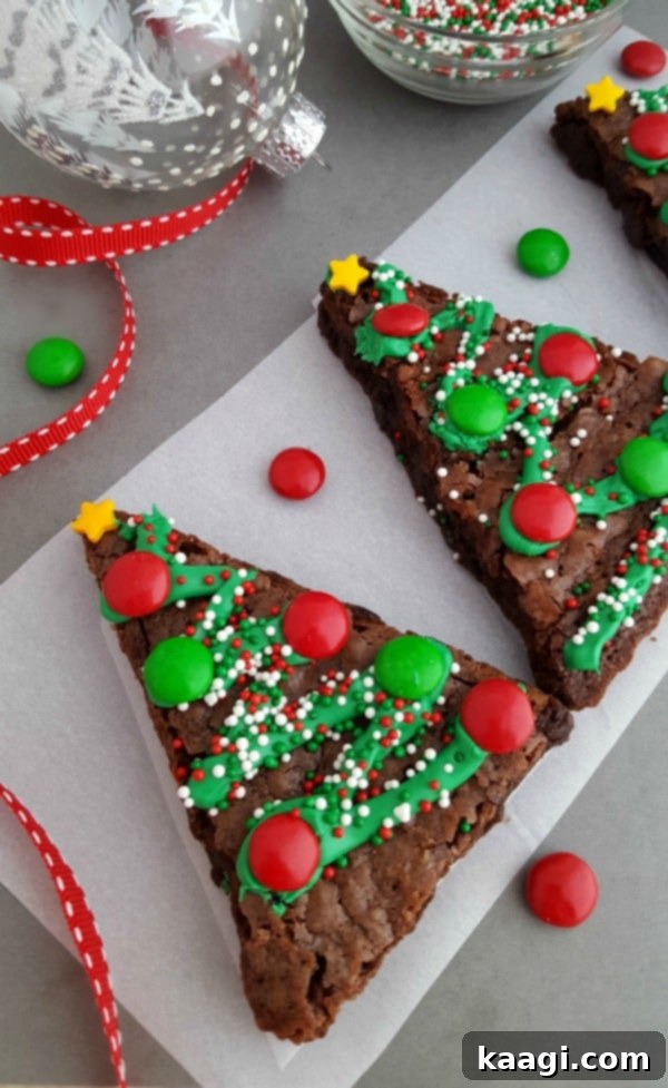 76 Effortless Christmas Goodies 8 Homemade Christmas Tree Brownies decorated with green frosting and sprinkles