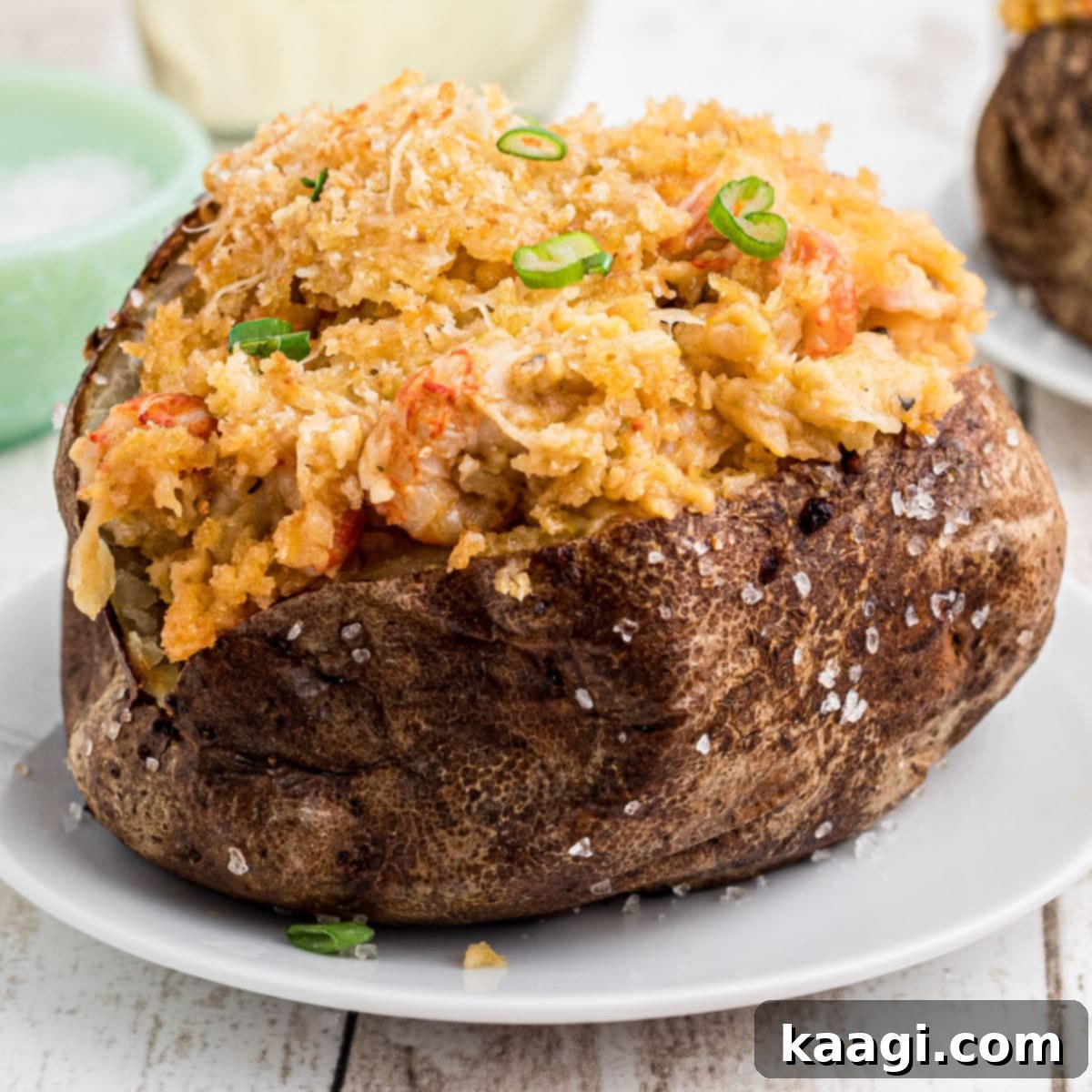 Close up of a crawfish baked potato cropped square.