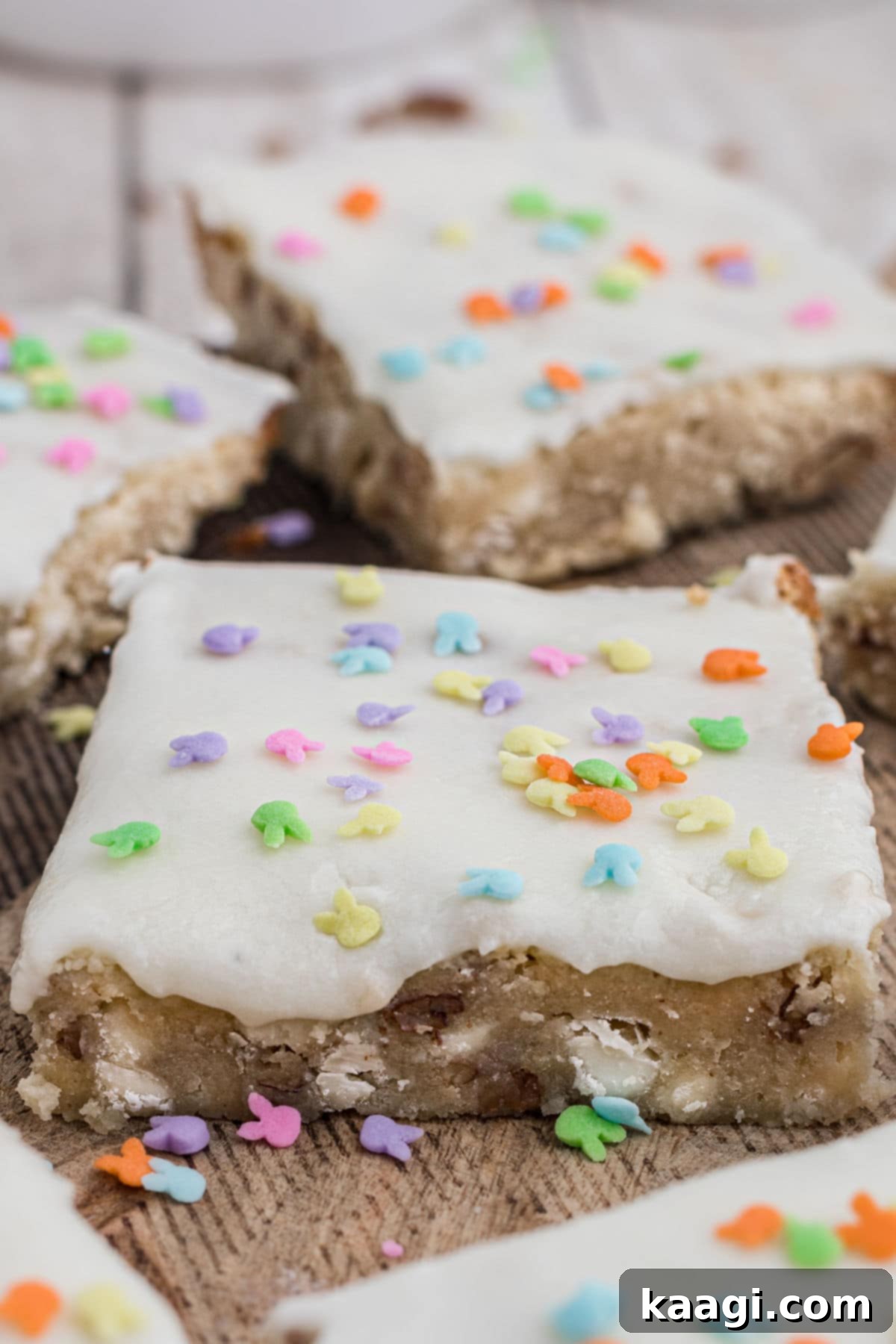 Vanilla brownies topped with white glaze and festive Easter bunny sprinkles