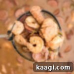 Cajun Gator's Cauldron 9 a ladle full of alligator gumbo - with shrimp alligator and sausage