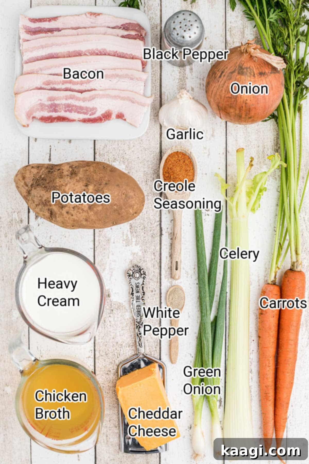 A curated display of fresh ingredients laid out, including diced bacon, various finely chopped vegetables like carrots, celery, and onions, alongside potatoes, a bottle of chicken broth, and heavy cream, all essential for the Saltgrass Baked Potato Soup recipe.