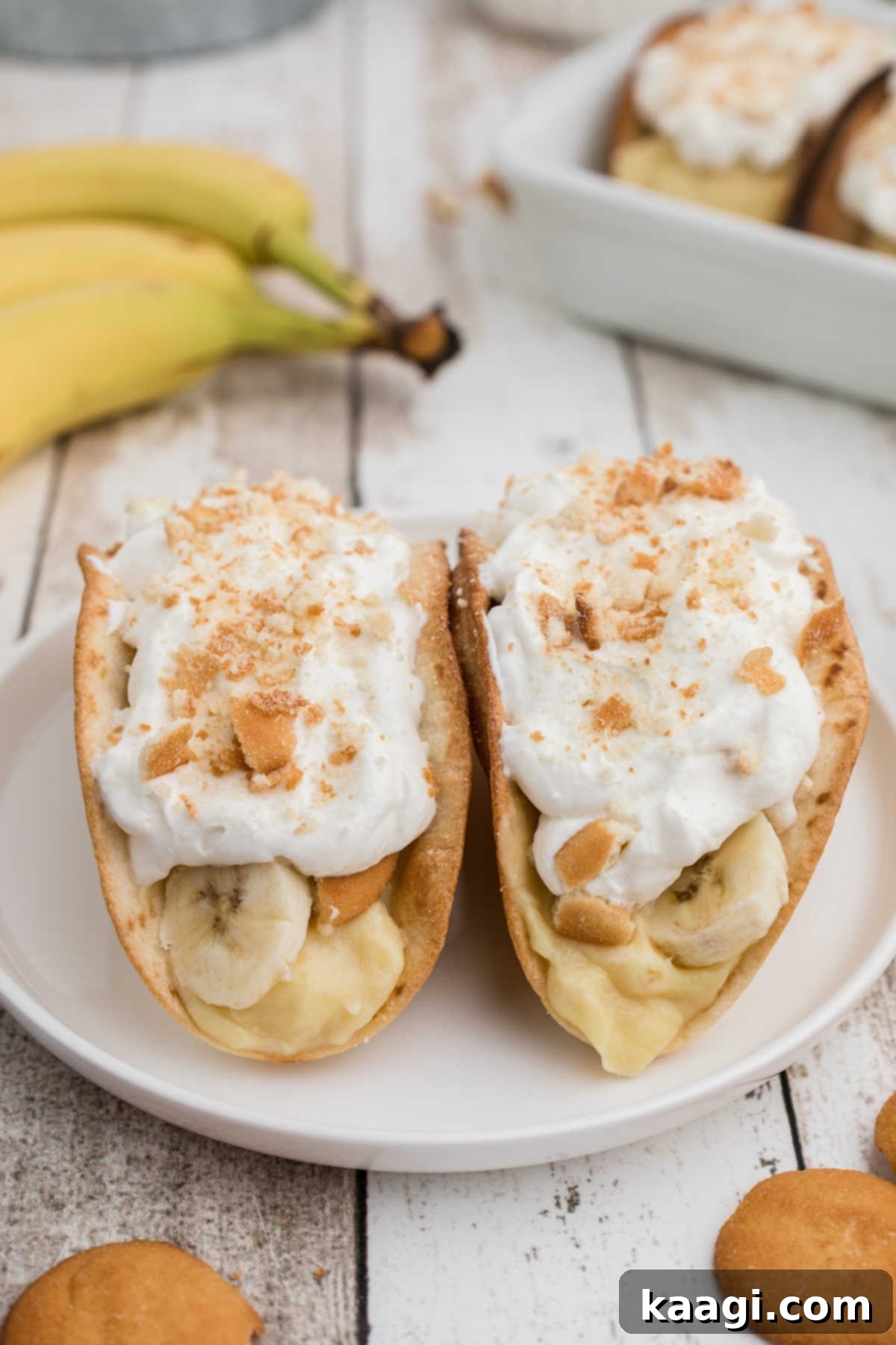 Dessert Taco Banana Dream 2 A plate featuring three beautifully assembled banana pudding tacos, ready to be enjoyed.