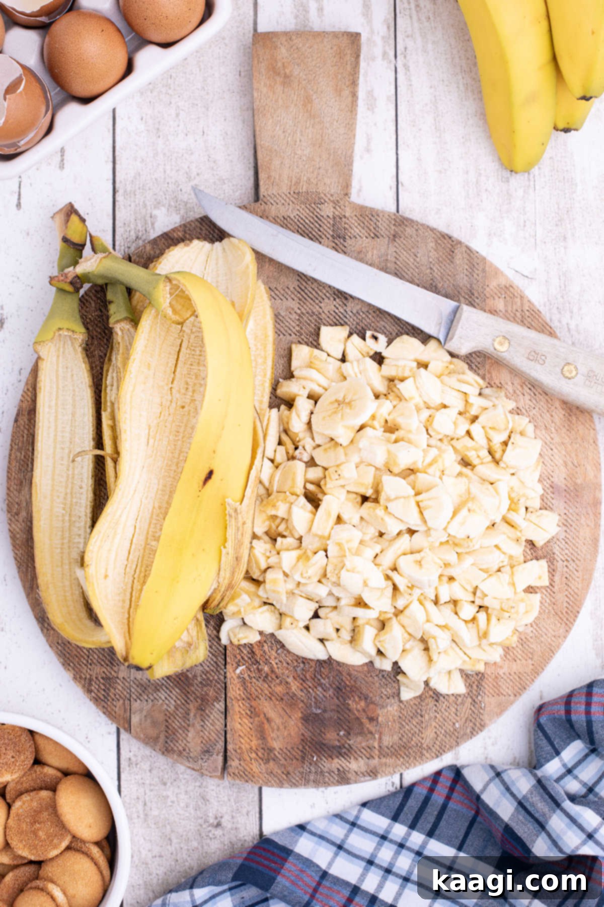 Luscious Banana Pudding Cupcakes 7 Bananas on a chopping board.
