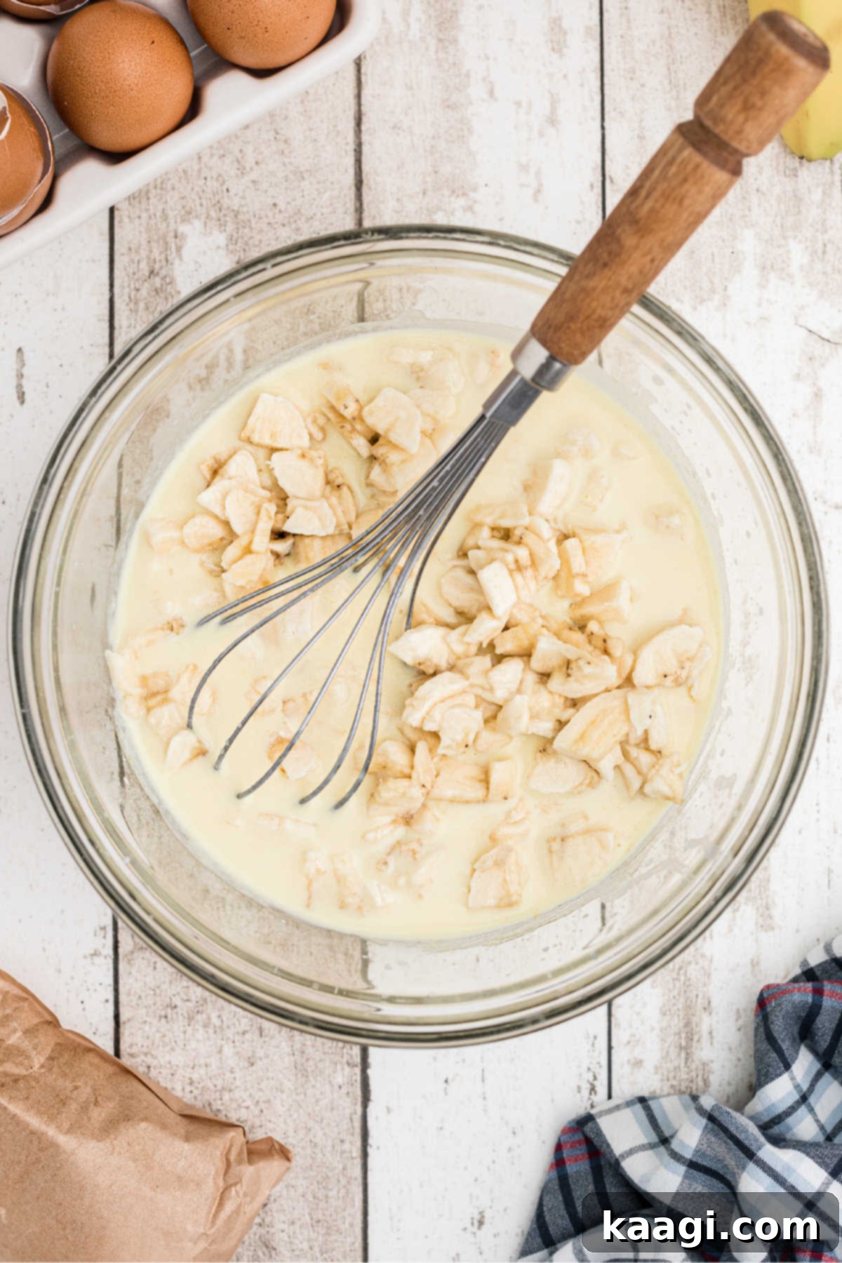 Luscious Banana Pudding Cupcakes 8 Chopped bananas being added to a pudding mix.