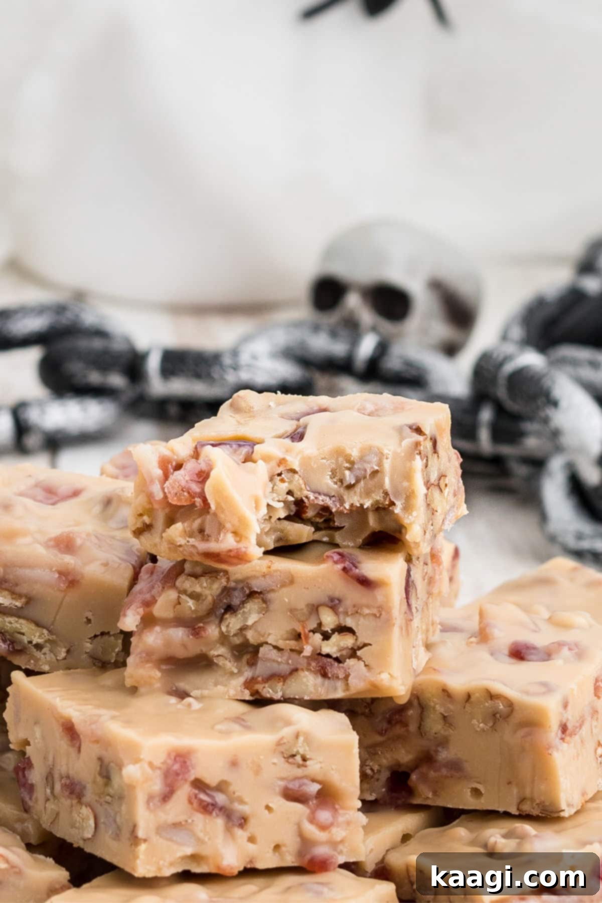 Voodoo Fudge with some decorative skulls in the background, perfect for Halloween themed desserts.