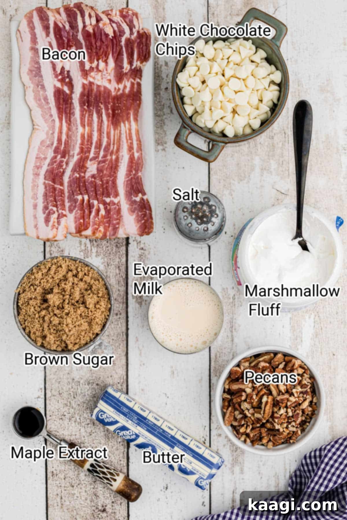 A collection of ingredients laid out for making maple bacon fudge, including bacon, sugars, milk, and chocolate chips.