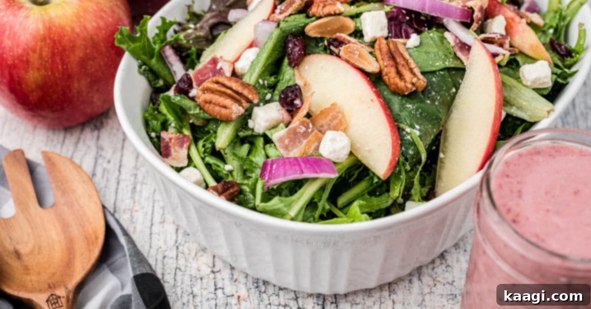 a close up of an apple cranberry salad