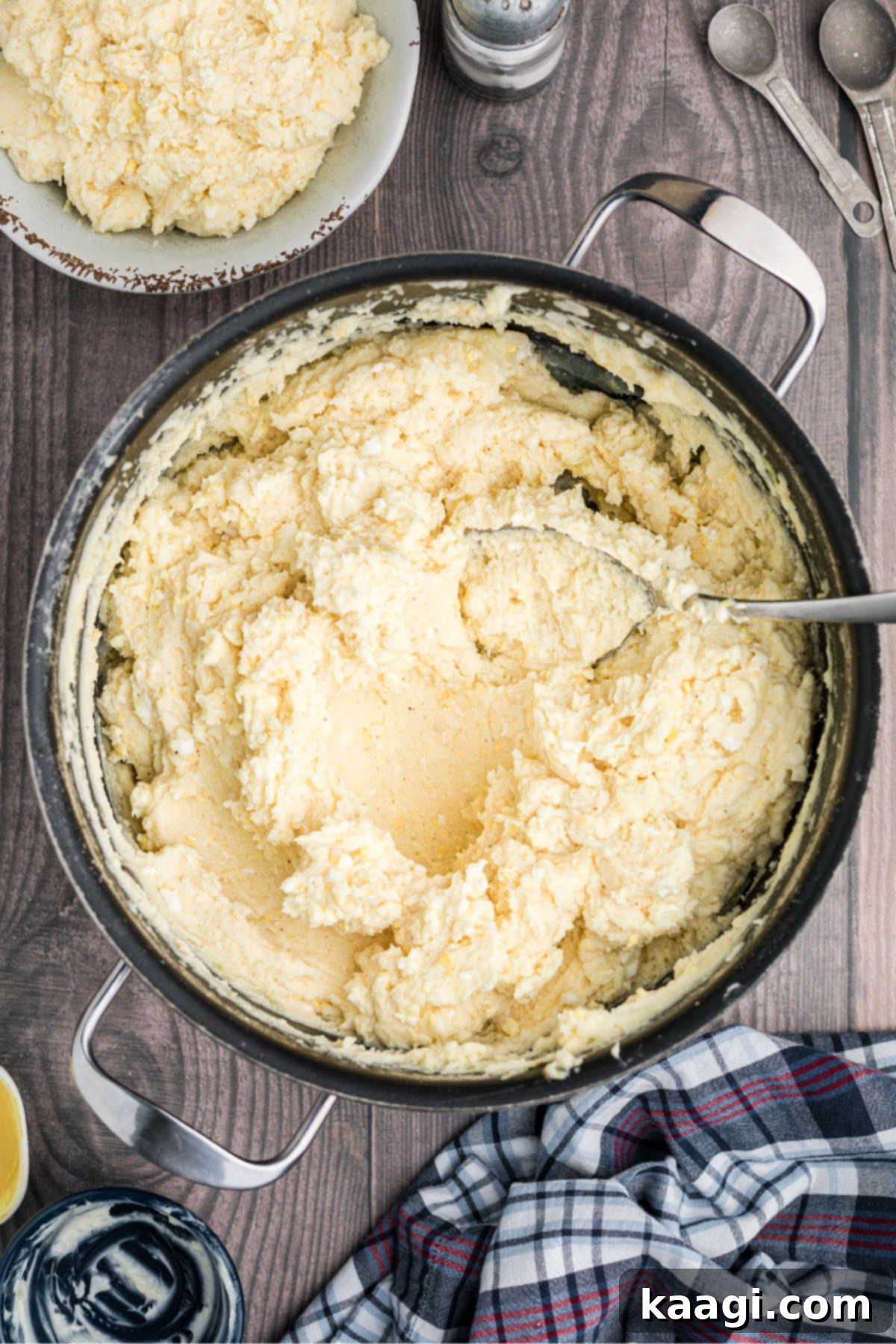 Zesty Cajun Potato Salad 9 A pot of creamy potato salad, with a spoonful removed, illustrating the option to separate a portion.