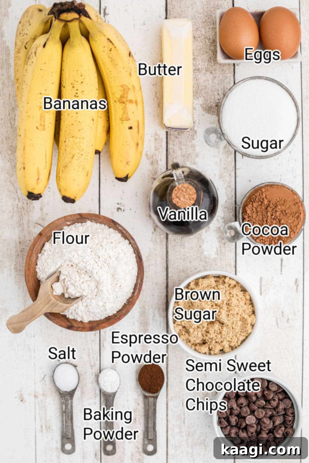 Decadent Banana Brownies 3 A collection of fresh ingredients laid out on a clean surface, ready for making delicious banana brownies, including bananas, chocolate chips, butter, and various flours and sugars.