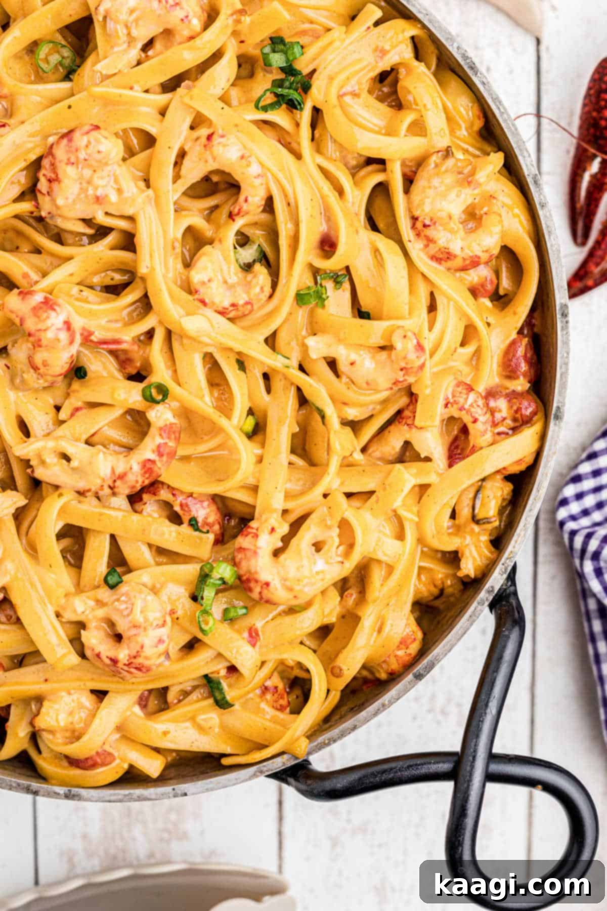 Creamy Cajun Crawfish Fettuccine 2 close up of a skillet of crawfish fettuccine