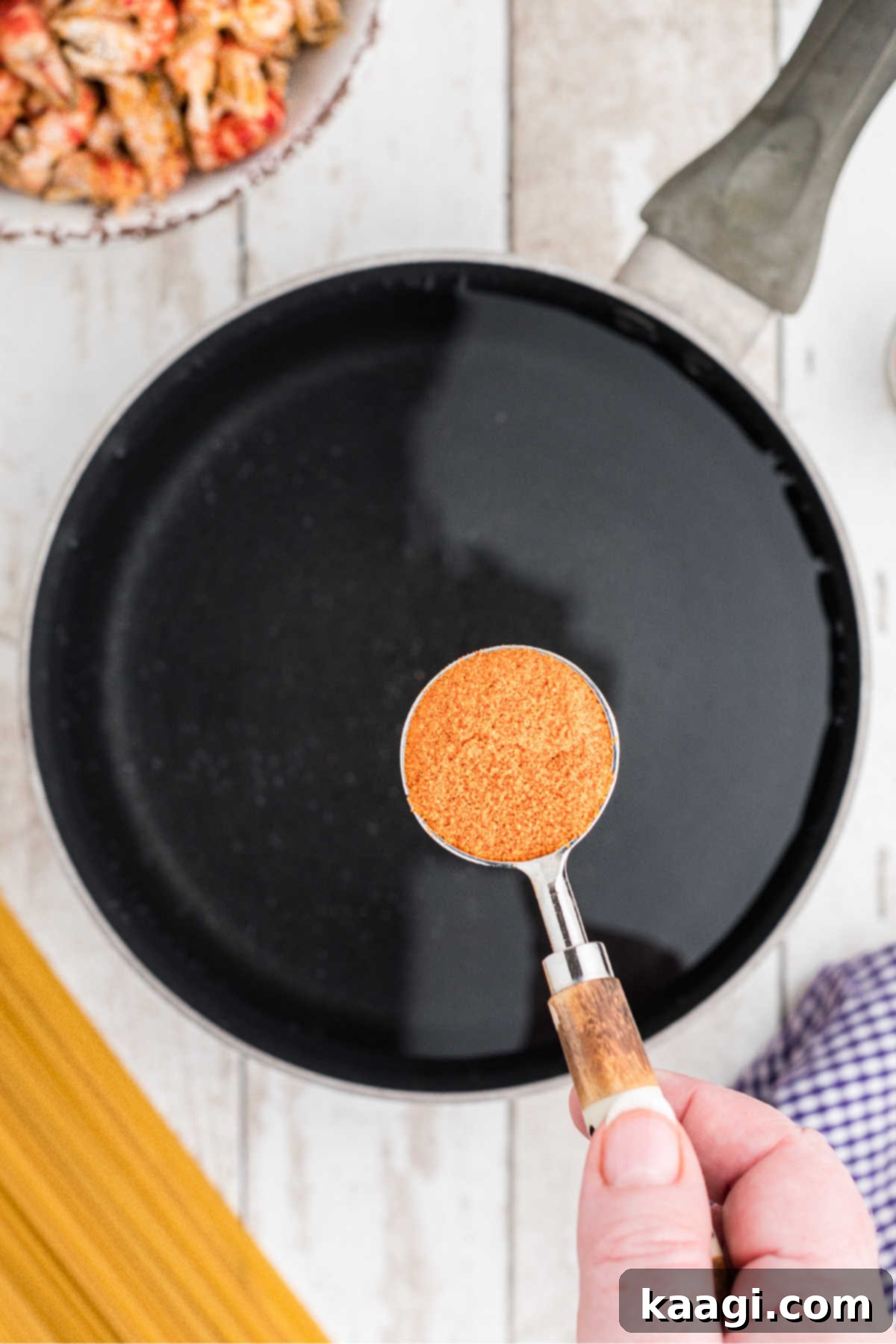 Creamy Cajun Crawfish Fettuccine 4 A large pot of water being boiled with some seasoning.