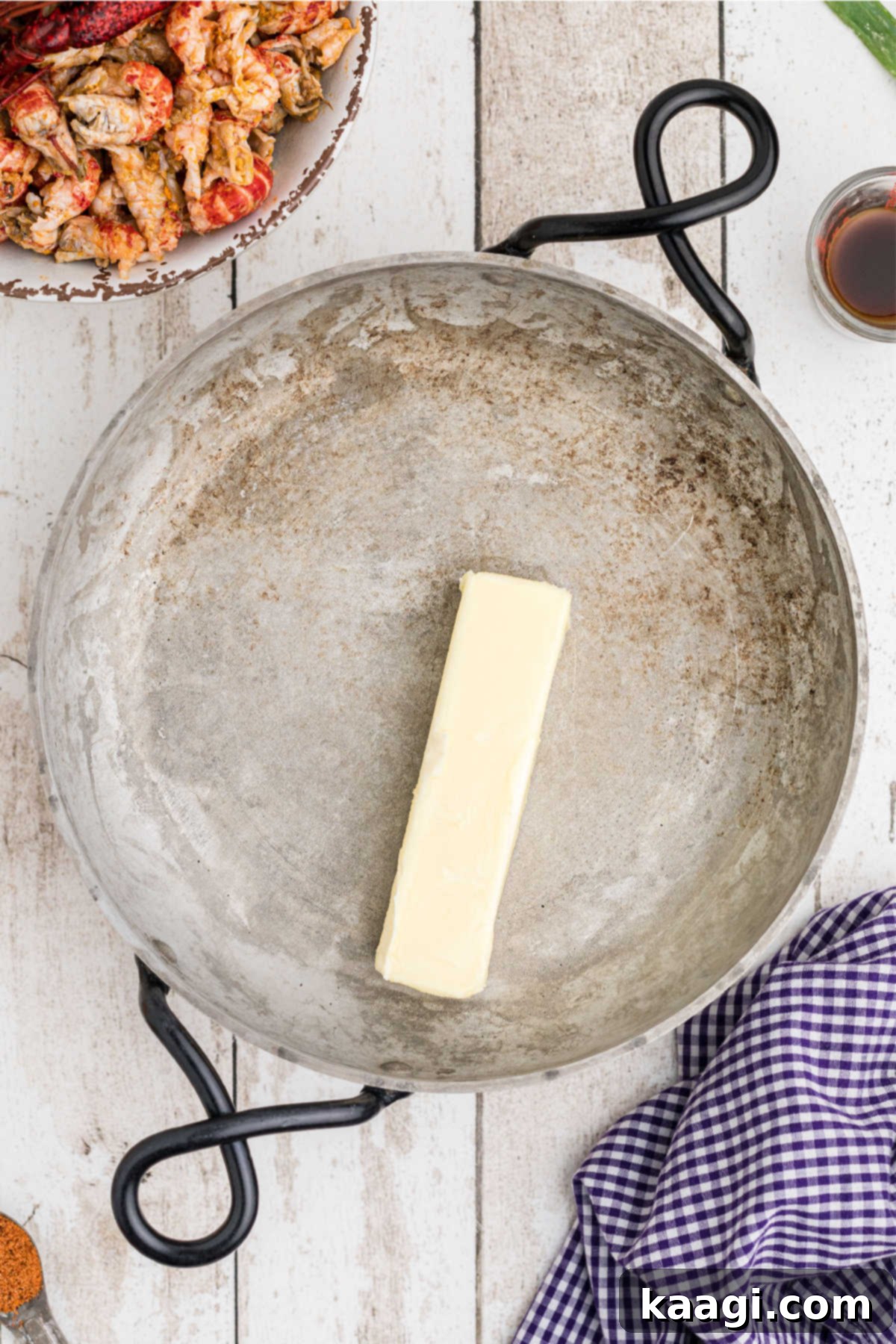 Creamy Cajun Crawfish Fettuccine 6 A skillet with a stick of butter melting over medium-high heat.