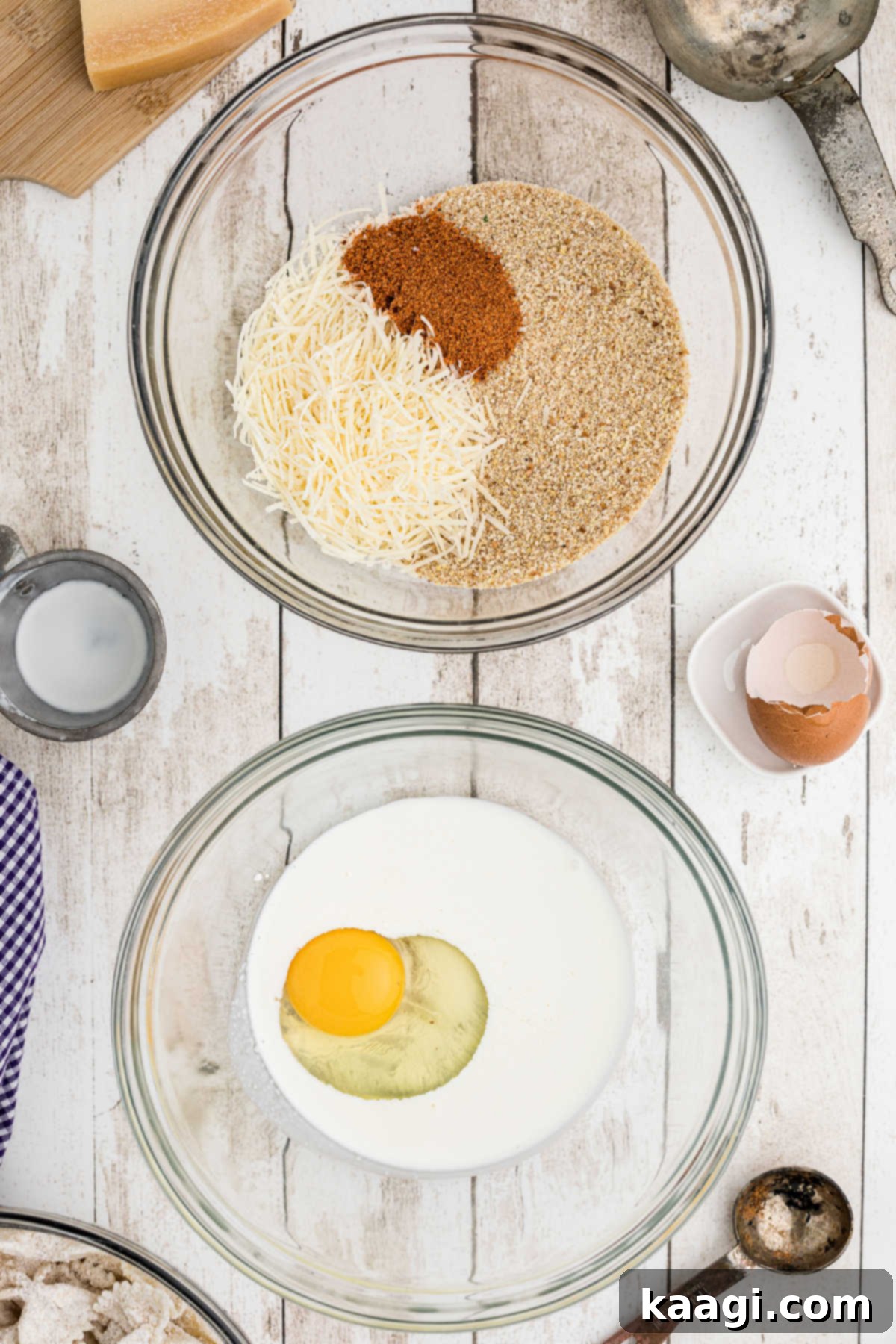 Crispy Farfalle Bites 7 Two separate bowls set up as dredging stations: one with a cream and egg mixture, and the other with breadcrumbs, parmesan cheese, and Creole seasoning.