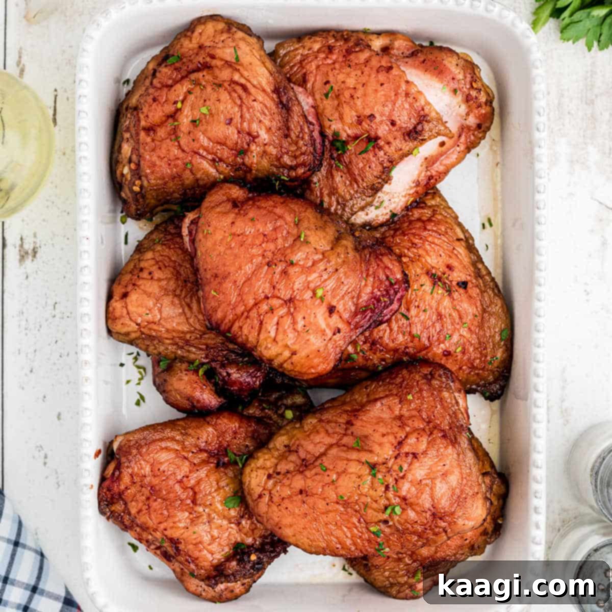 Southern Grilling Essentials 17 A dish full of perfectly smoked chicken thighs with a rich, dark crust.