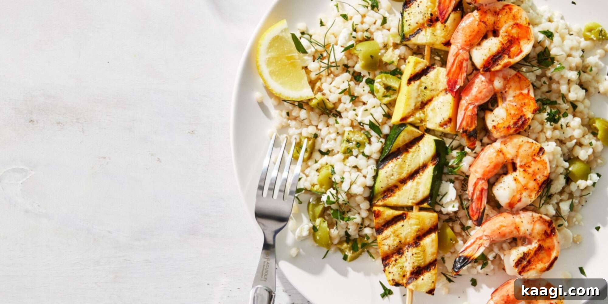 Southern Grilling Essentials 29 Grilled shrimp and squash skewers served alongside herbed couscous.