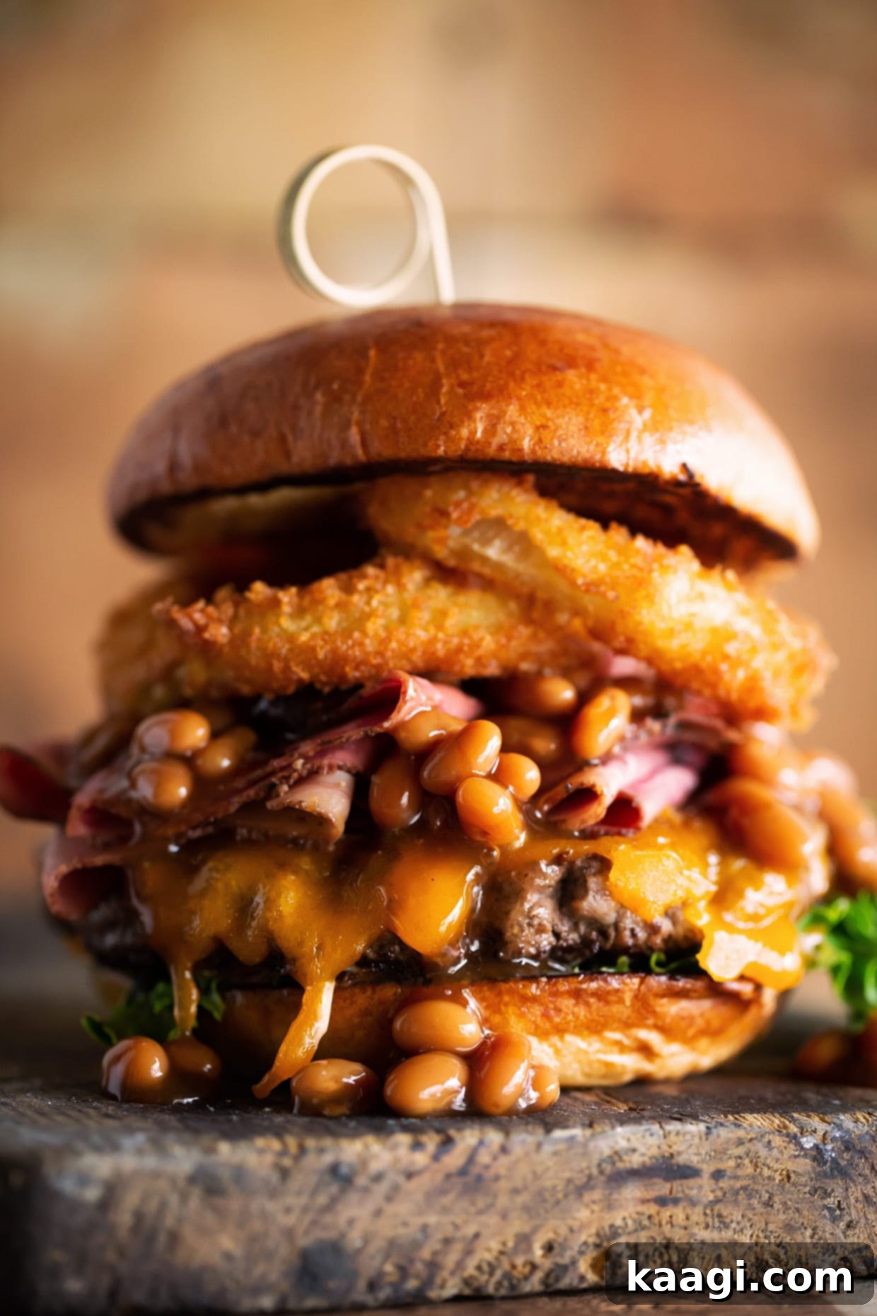 Southern Grilling Essentials 4 A towering Southern BBQ Burger loaded with pastrami, baked beans, and crispy onion rings.