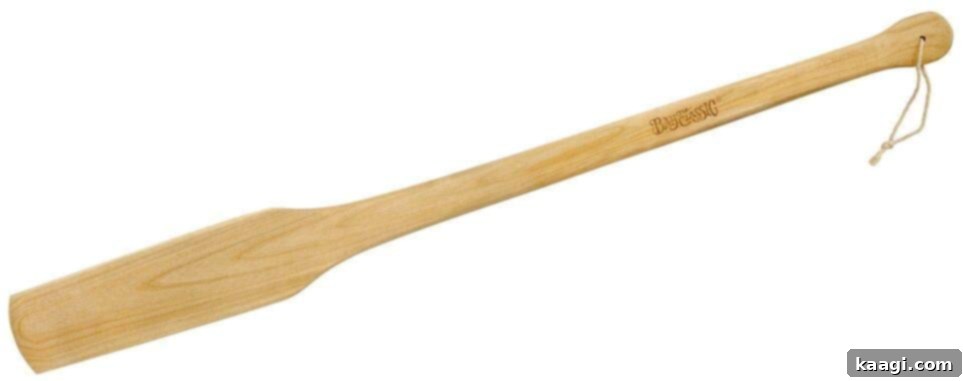 The Ultimate Crawfish Boil 14 A long, sturdy wooden paddle, an essential tool for stirring large pots of seafood during a crawfish boil.